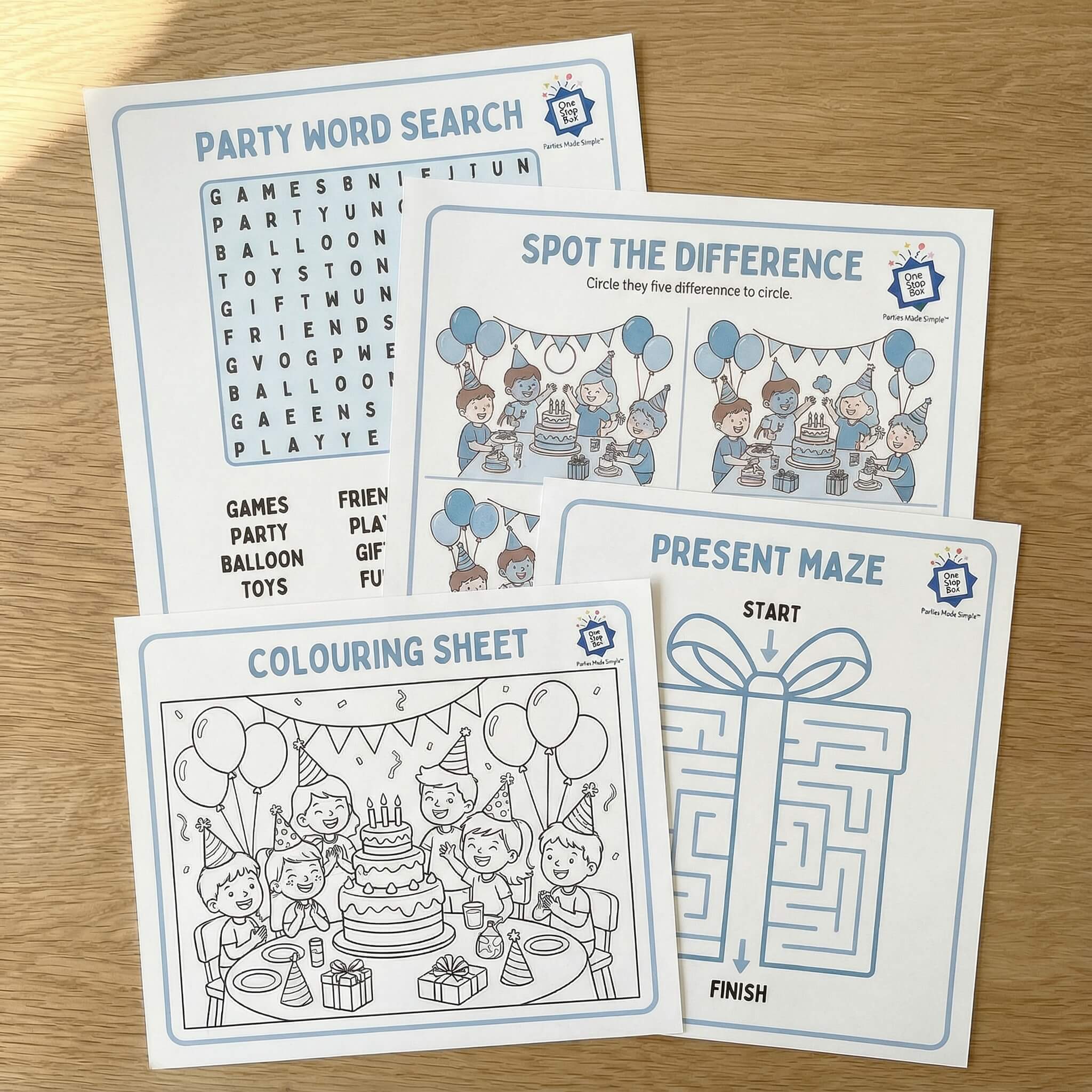 OneStopBox set of party-themed activity sheets including a word search, spot the difference, present maze, and coloring sheet on a wooden surface.