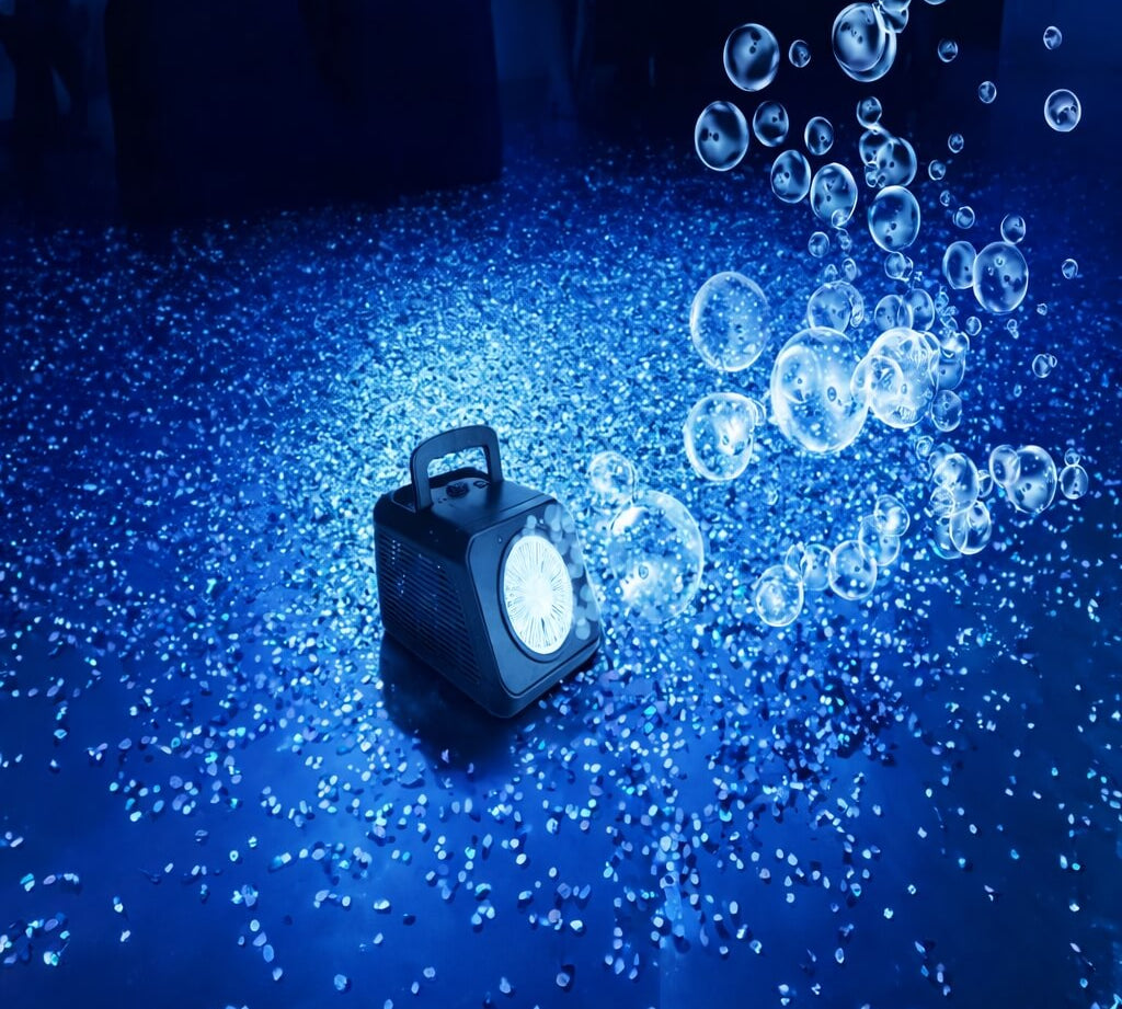 Party bubble machine blowing bubbles across a glitter covered dance floor lit in blue, kids party decorations accessory.