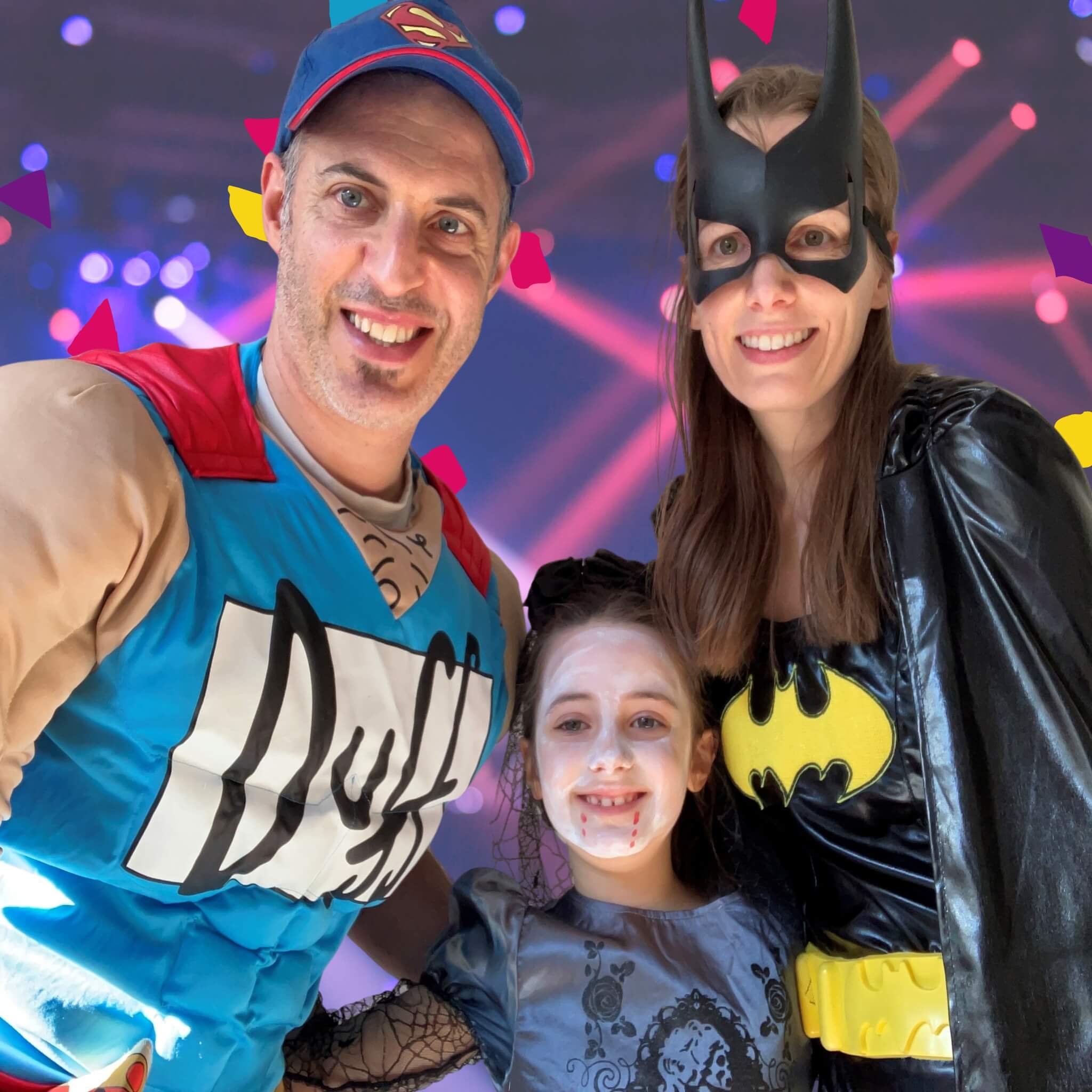 Two adults and a child in superhero costumes against a colorful, festive background. About OneStopBox founder and Chief Party Officer