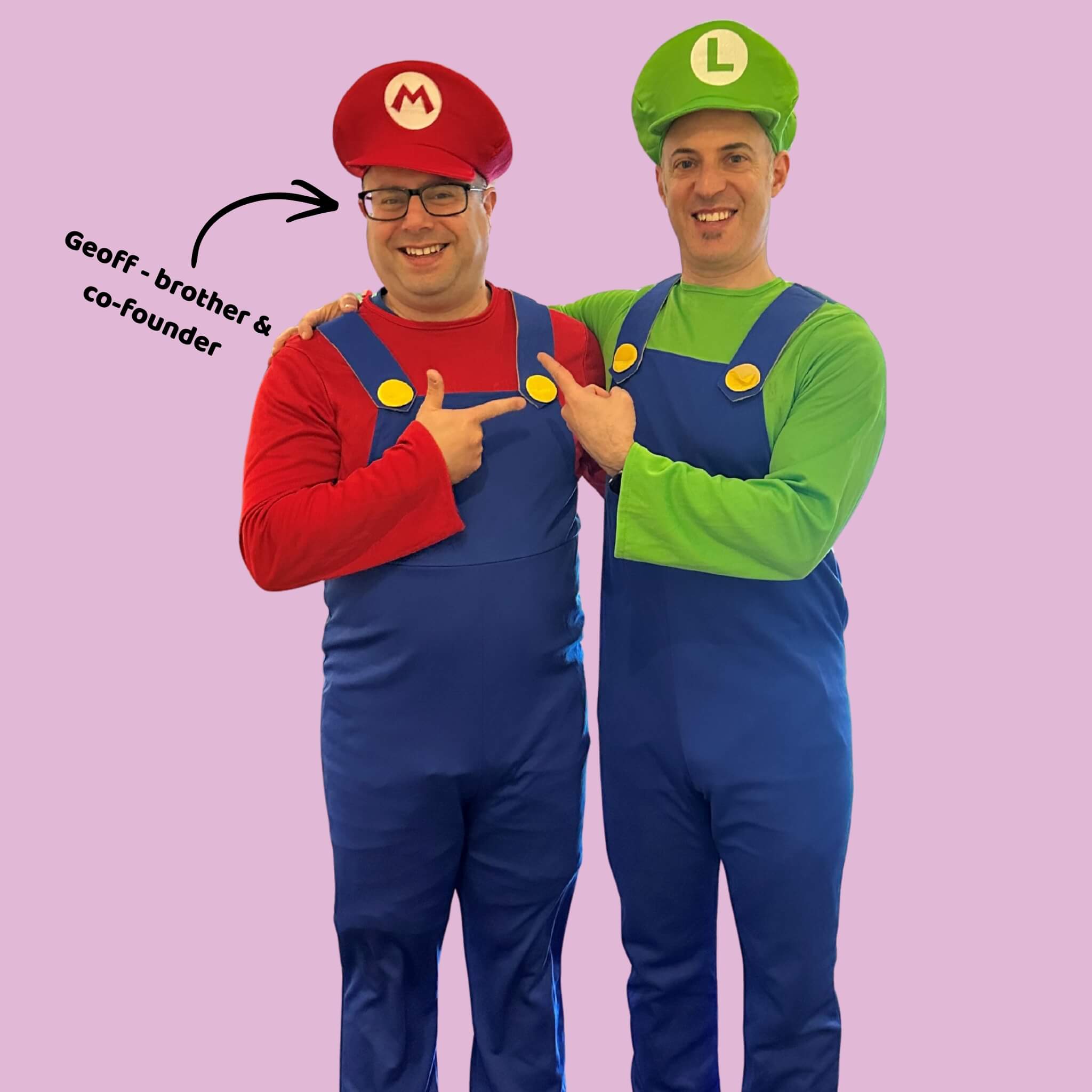 Two men dressed as Mario and Luigi from Super Mario, with a pink background. OneStopBox founders Paulie and Geoff