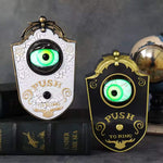 Animatronic Halloween doorbell decoration prop with sound and motion, shown as a pair