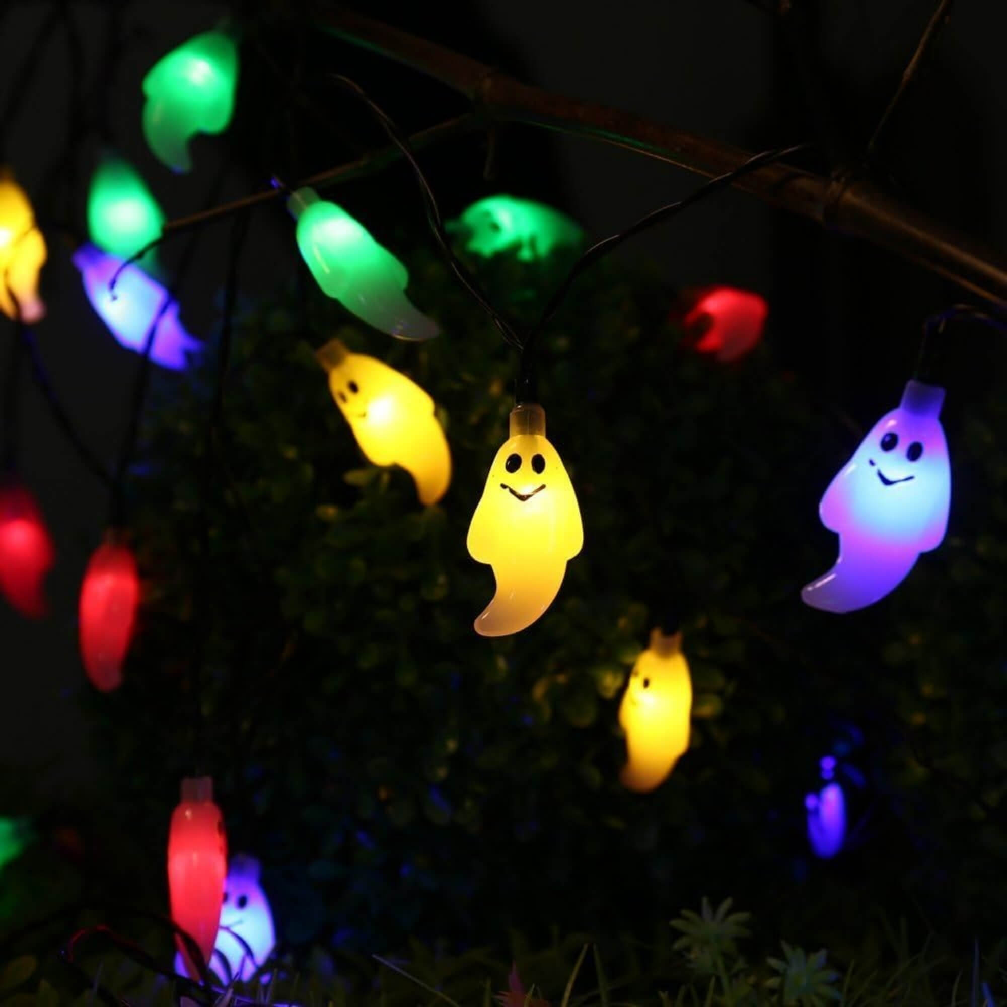 10m LED ghost string lights Halloween decoration with multiple colours and remote, hung on a tree