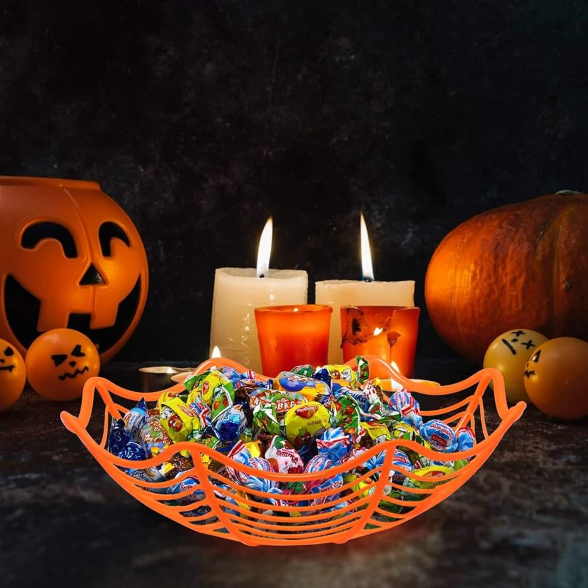 Spider web design Halloween candy bowls, pack of 4, orange colourway, filled with candy