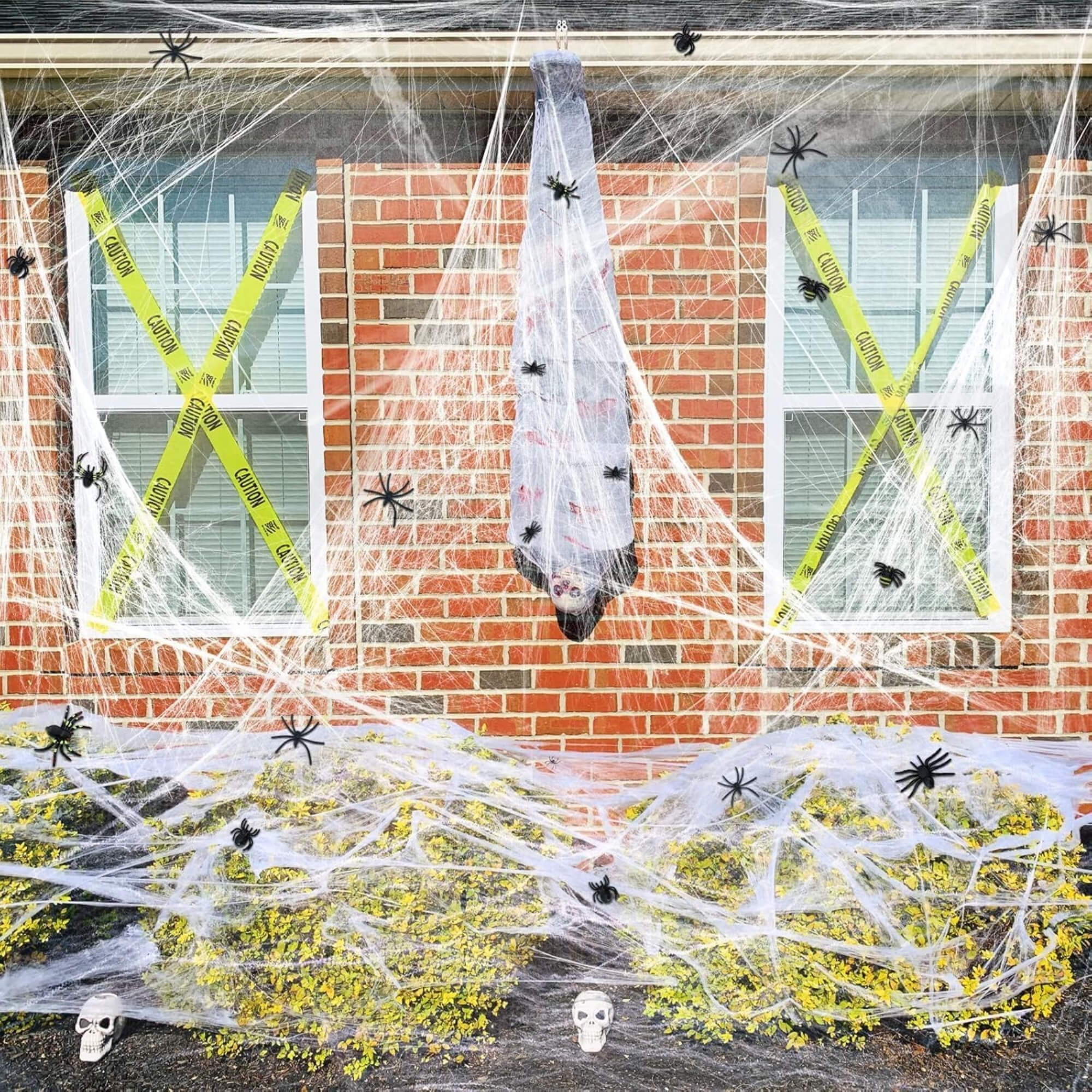 White stretchable Halloween spider web cobweb decoration, on a window