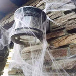 Glow-in-the-dark Halloween spider web cobweb decoration, lit up