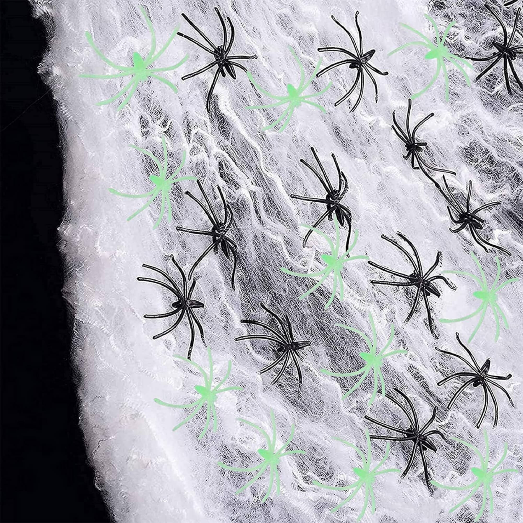 Glow-in-the-dark Halloween spider web cobweb decoration, with spiders