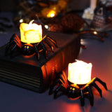 Spider design LED tealight candle Halloween decoration, styled with books