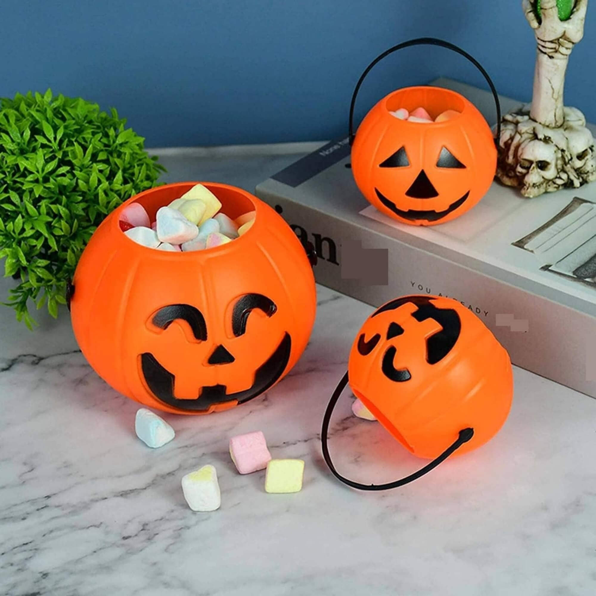 Jack-o'-lantern pumpkin trick-or-treat bucket Halloween decoration, filled with marshmallows