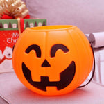 Jack-o'-lantern pumpkin trick-or-treat bucket Halloween decoration, styled scene