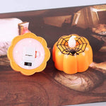 Small orange pumpkin LED tealight candle Halloween decoration, base view