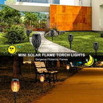 Solar-powered Halloween tiki torch garden light, daytime shot, lit at night