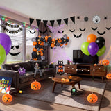 Complete premium Halloween party decorations filling a living room, including orange and black balloon garland, printed Halloween balloons, bat wall decorations, spider web garland, pumpkin lanterns, ghost backdrop, black triangle bunting, Halloween table cover and character props from a OneStopBox all-in-one party kit.