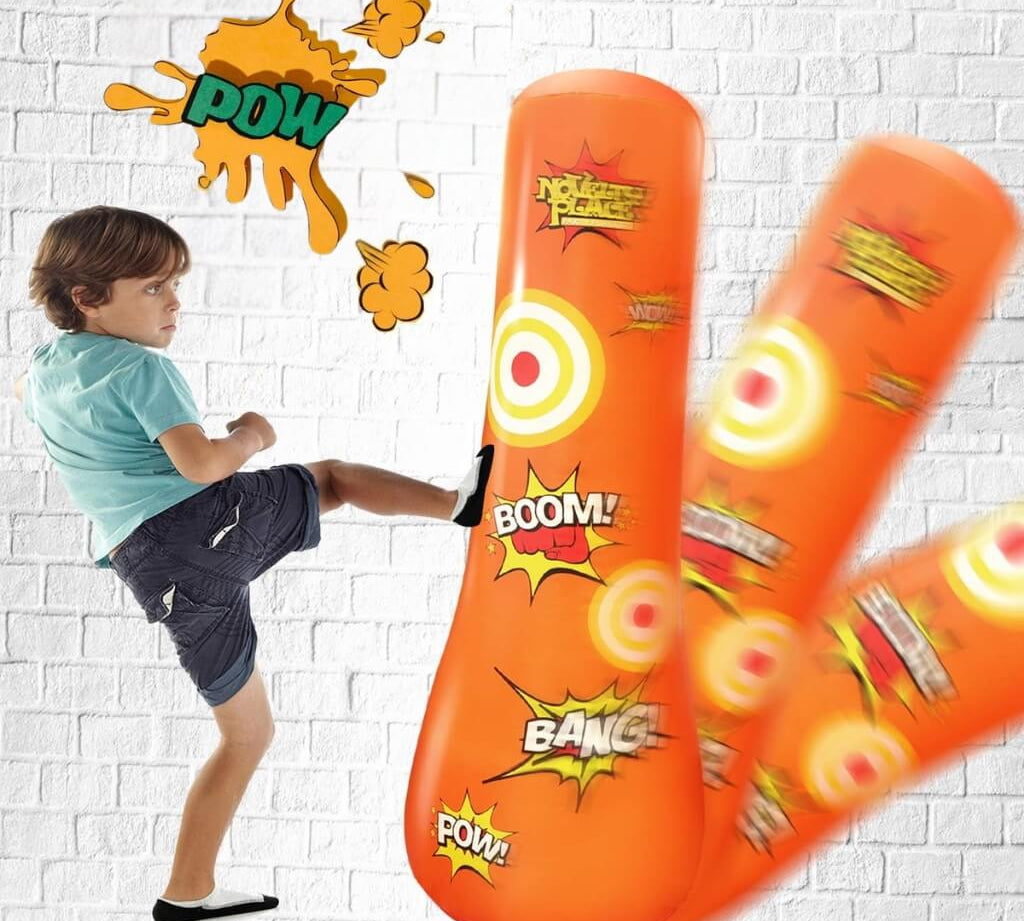 Child kicking an orange inflatable punching bag with comic sound effects on a white brick wall background.