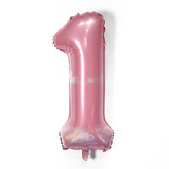 Pink number '1' balloon on a white background