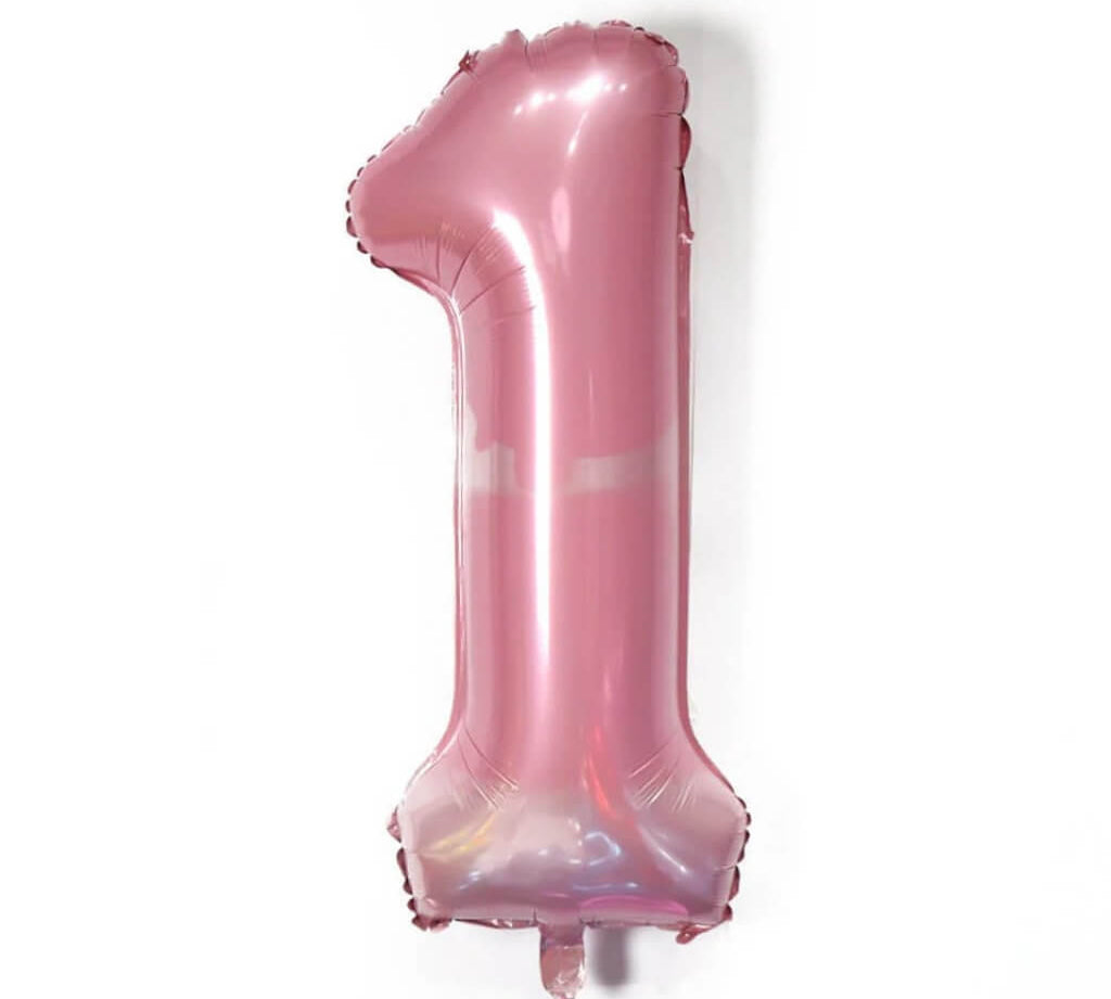 Pink number '1' balloon on a white background