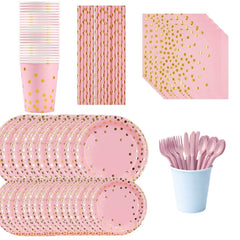 Pink and gold party supplies including plates, cups, straws, and cutlery.