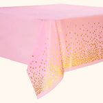 Pink party table cover with gold foil polka dot design