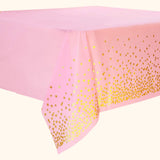 Pink party table cover with gold foil polka dot design
