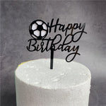 Sports-themed cake topper with ball design