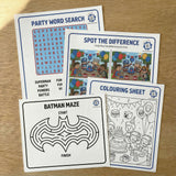 Set of children's activity sheets including a word search, spot the difference, colouring sheet, on a wooden surface.