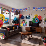 Living room decorated with superhero balloons and banners for a party. Includes balloons, banners and bunting