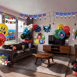 Living room decorated with superhero balloons and banners for a party. Includes balloons, banners and bunting